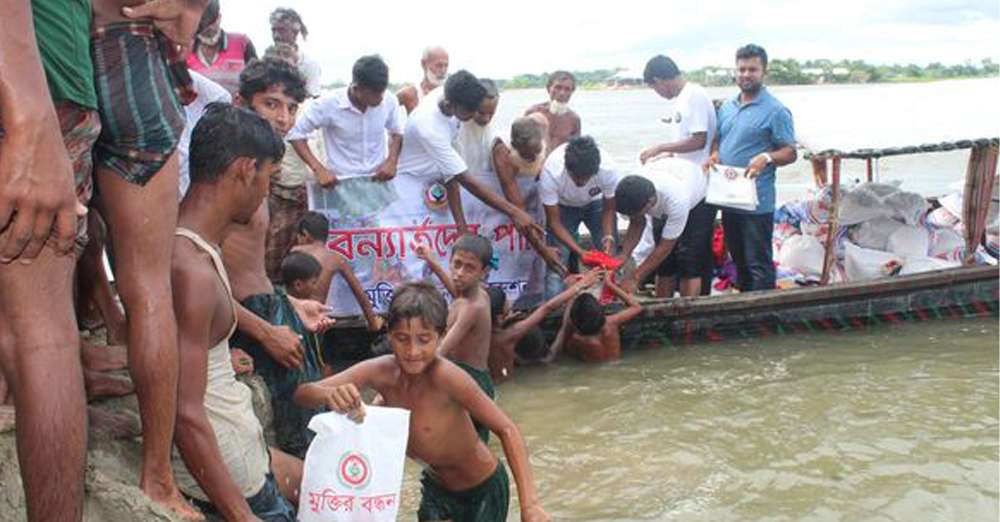 Distribution of relief among the flood victims in Uchakhila, Mymensingh